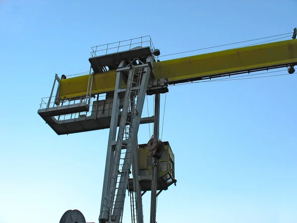 Industrial crane detail against blue sky — Stock Photo, Image