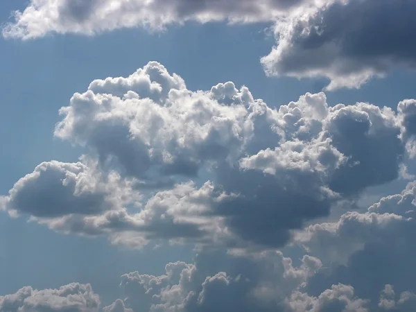 White cumulus clouds over blue sky — Stock Photo, Image