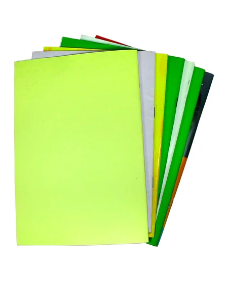 Siete cuadernos de colores aislados — Foto de Stock
