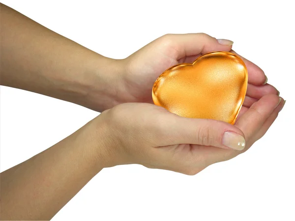 Mänskliga lady händer som håller gyllene hjärta — Stockfoto