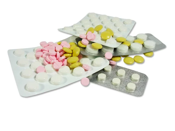 Белые и цветные таблетки от наркотиков в волдырях — стоковое фото