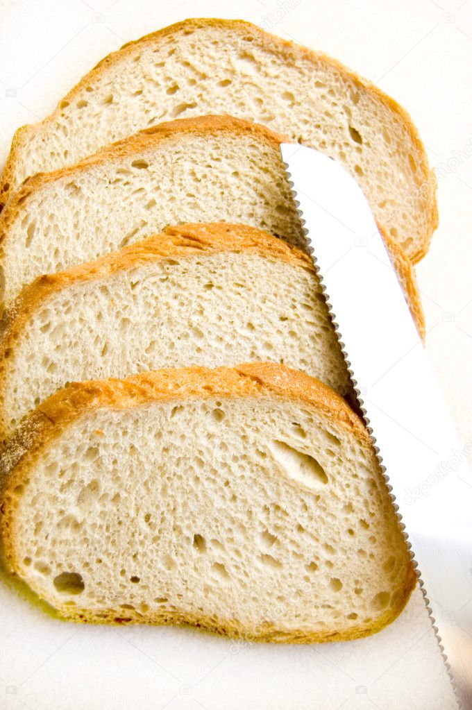 Bread and knife conceptual image.