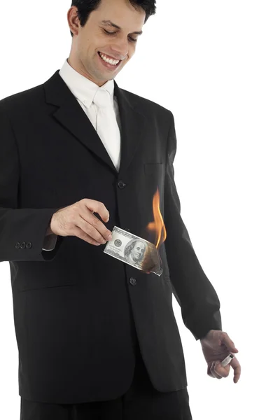 Homem de negócios queimando dinheiro — Fotografia de Stock