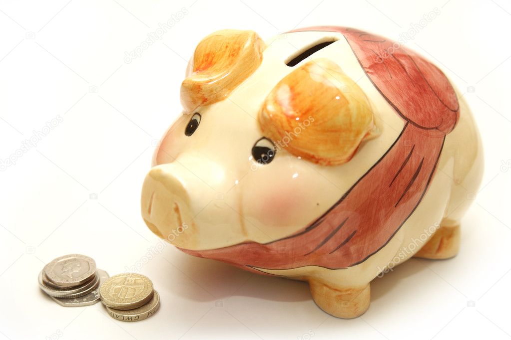 Piggy Bank Next to Coins