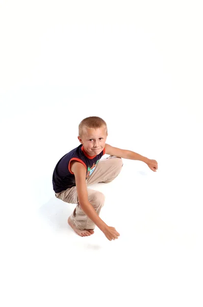 Sitting boy looking in the camera — Stock Photo, Image