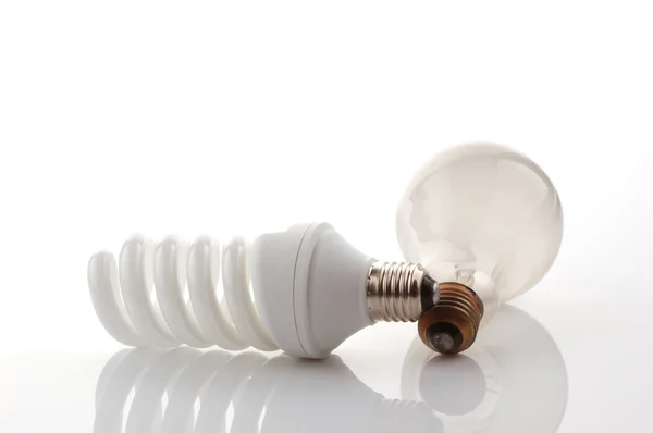 stock image Light bulb and energy saver lamp