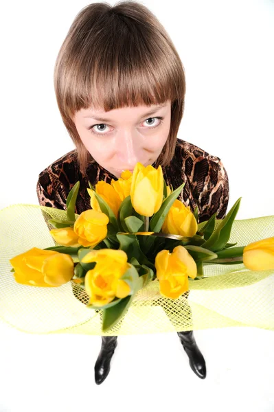 Girl with bouquet of yellow tulips — Stock Photo, Image