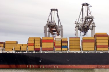 Containership being unloaded clipart