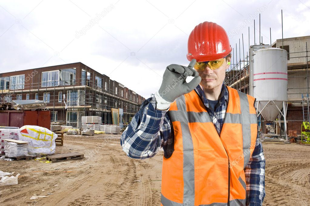 Saluting construction worker
