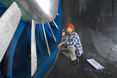 Inspecting a windtunnel clipart