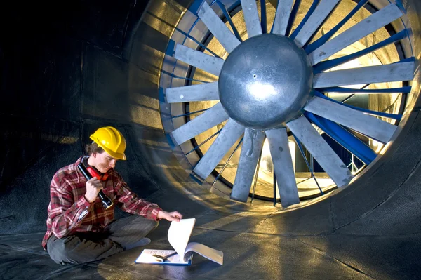An engineer looking at his notes — Stock Photo, Image
