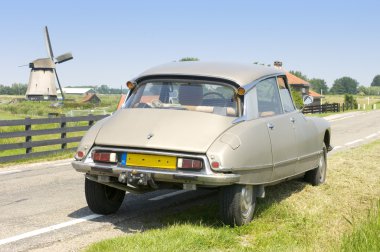 Dutch scene with a French Classic Car clipart