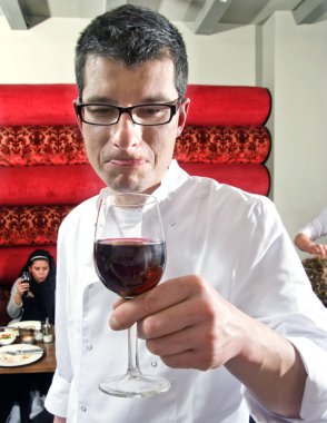 Wine waiter savouring wine clipart