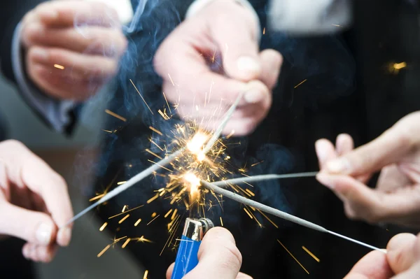 Igniting spark sticks — Stock Photo, Image