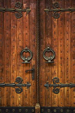 Church doorway with wooden doors clipart