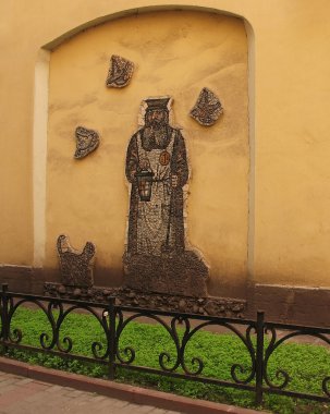 A wall with a mosaic in the courtyard clipart