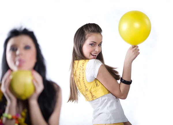 Girl with fruit and girl with balloon — Stock Photo, Image
