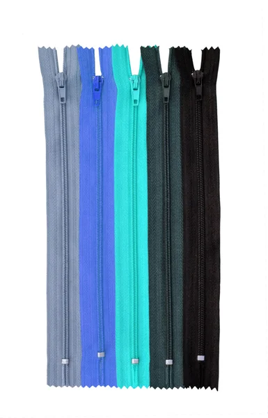 Blue and turquoise zips/ zippers — Stock Photo, Image