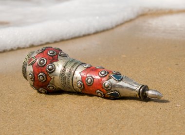 Ancient bottle cast ashore clipart