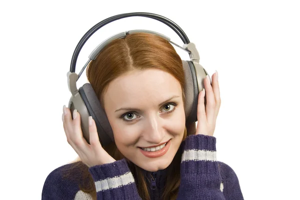Leende kvinna med hörlurar — Stockfoto