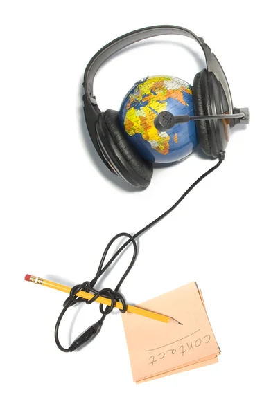 Auriculares en el mundo globo con lápiz — Foto de Stock