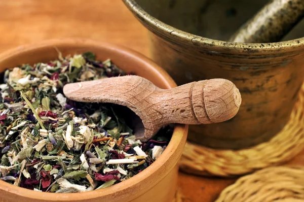 Mortar with bowl and herbs — Stock Photo, Image