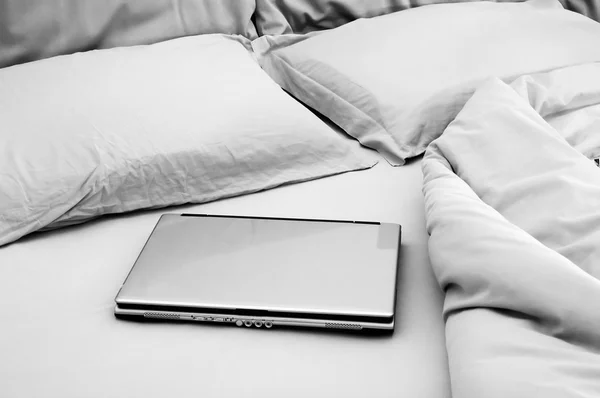 stock image Laptop on unmade bed