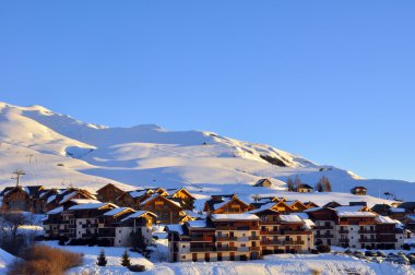 Ski resort in evening clipart