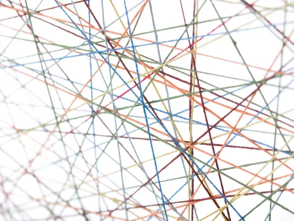 Cobweb из цветных нитей — стоковое фото