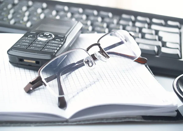 Notebook,glasses, keyboard — Stock Photo, Image