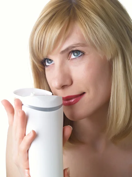 Cosmetica pot in een hand — Stockfoto