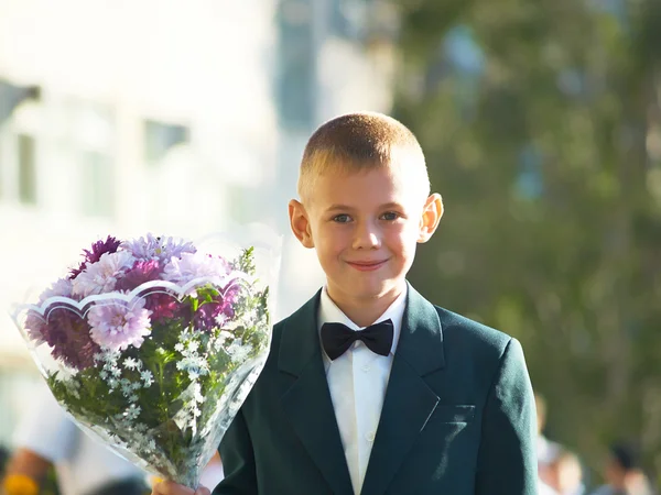 The boy with a bouquet of colors — Stock Photo, Image