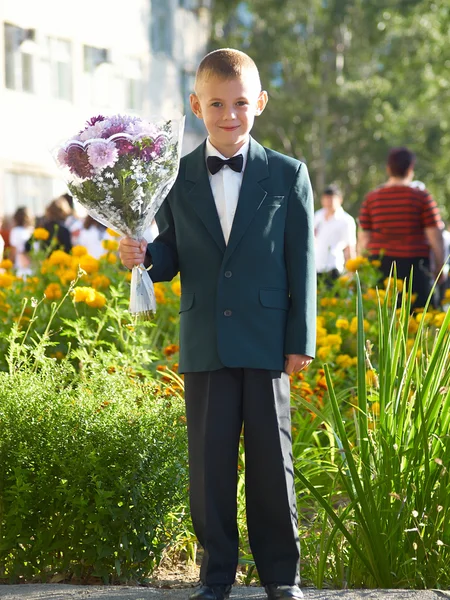 The boy with a bouquet of colors — Stock Photo, Image