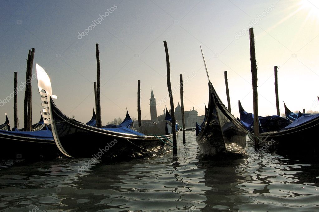 Sunset and gondolas in Venice