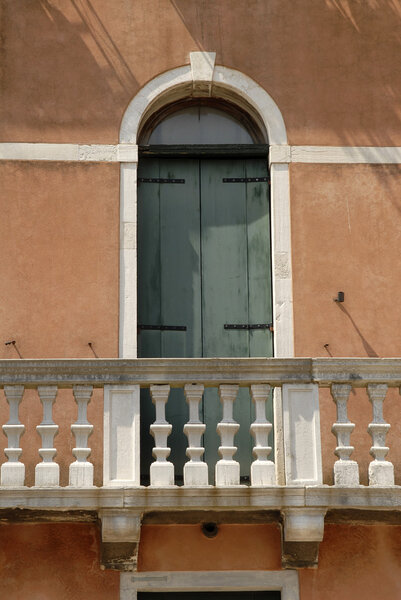 Architectural detail of green door and balcony, Venice, Italy