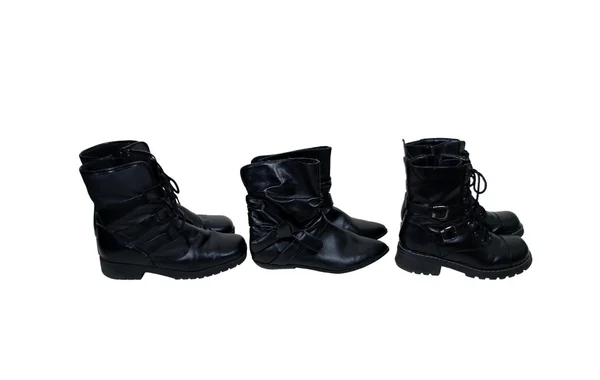 Várias botas de couro preto — Fotografia de Stock