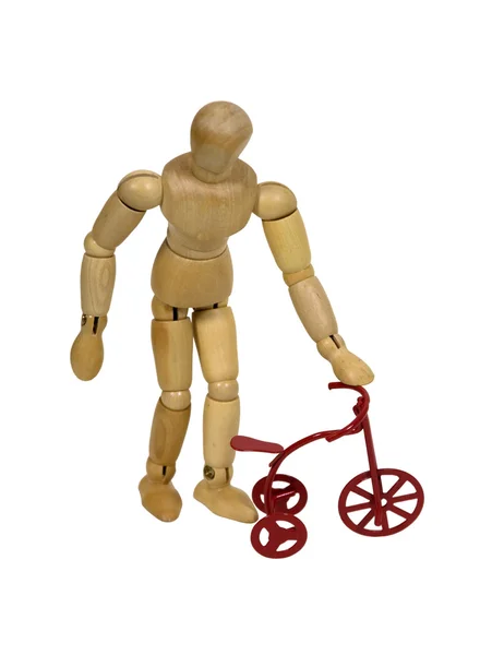 Çocuk ile kırmızı üç tekerlekli bisiklet — Stok fotoğraf