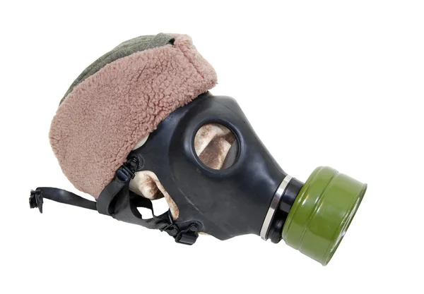 Plynovou masku a vojenské čepici — Stock fotografie