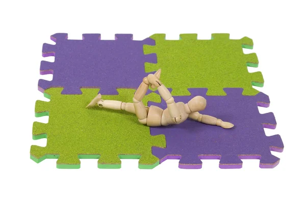 Gymnastika protahování na podložce — Stock fotografie