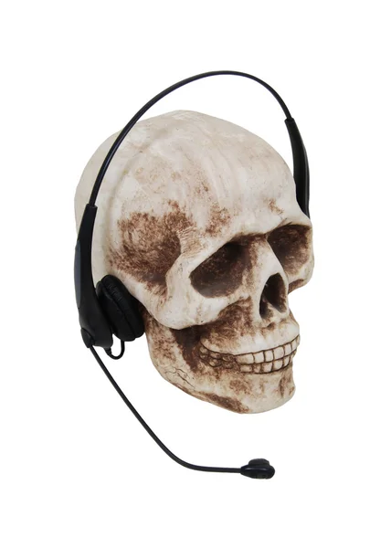 Hoofdtelefoon op een schedel — Stockfoto