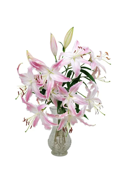 Розовые и белые лилии в хрустальной вазе — стоковое фото