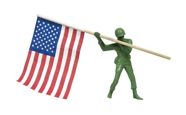 Soldado portando bandera americana —  Fotos de Stock