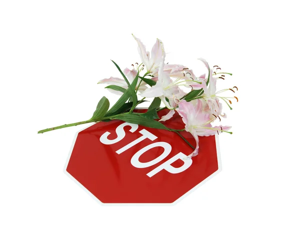 Stop sign and lilies — Stock Photo, Image