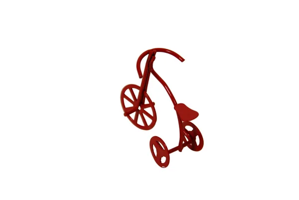 Червоний триколісний велосипед — стокове фото