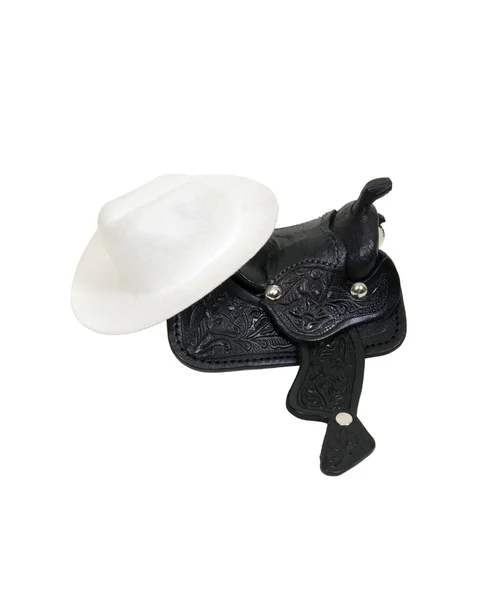 Cowboyhatt och sadeln — Stockfoto
