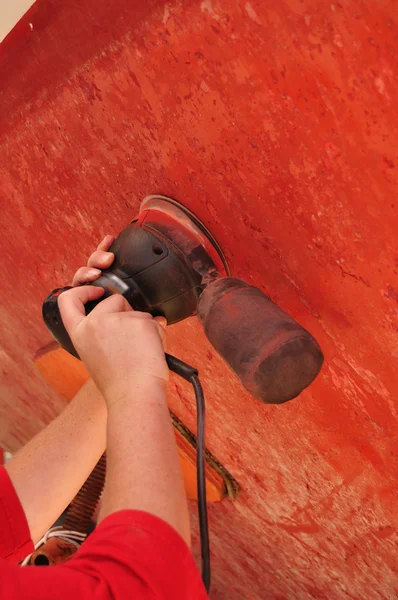 stock image Sanding Sailboat Hull with a Sander