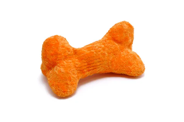 橙色狗骨玩具 — 图库照片
