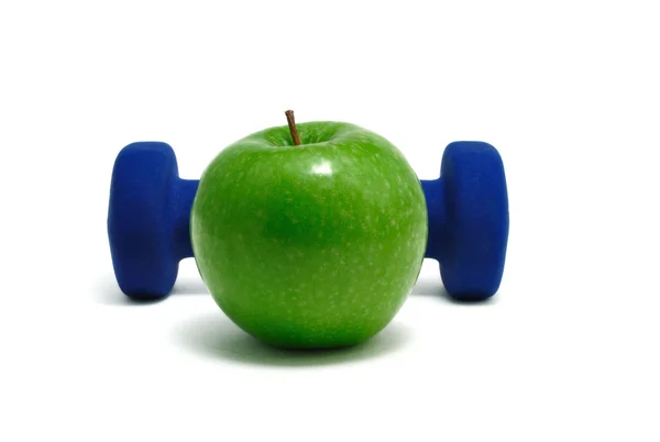 Синий вес и зеленое яблоко — стоковое фото
