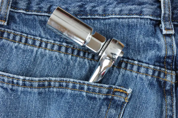 Ratchet and Socket in Blue Jeans Pocket — Stock Photo, Image