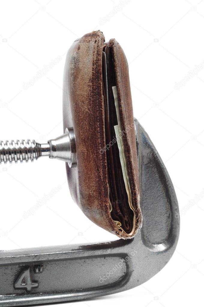 Old Wallet Being Squeezed in Clamp